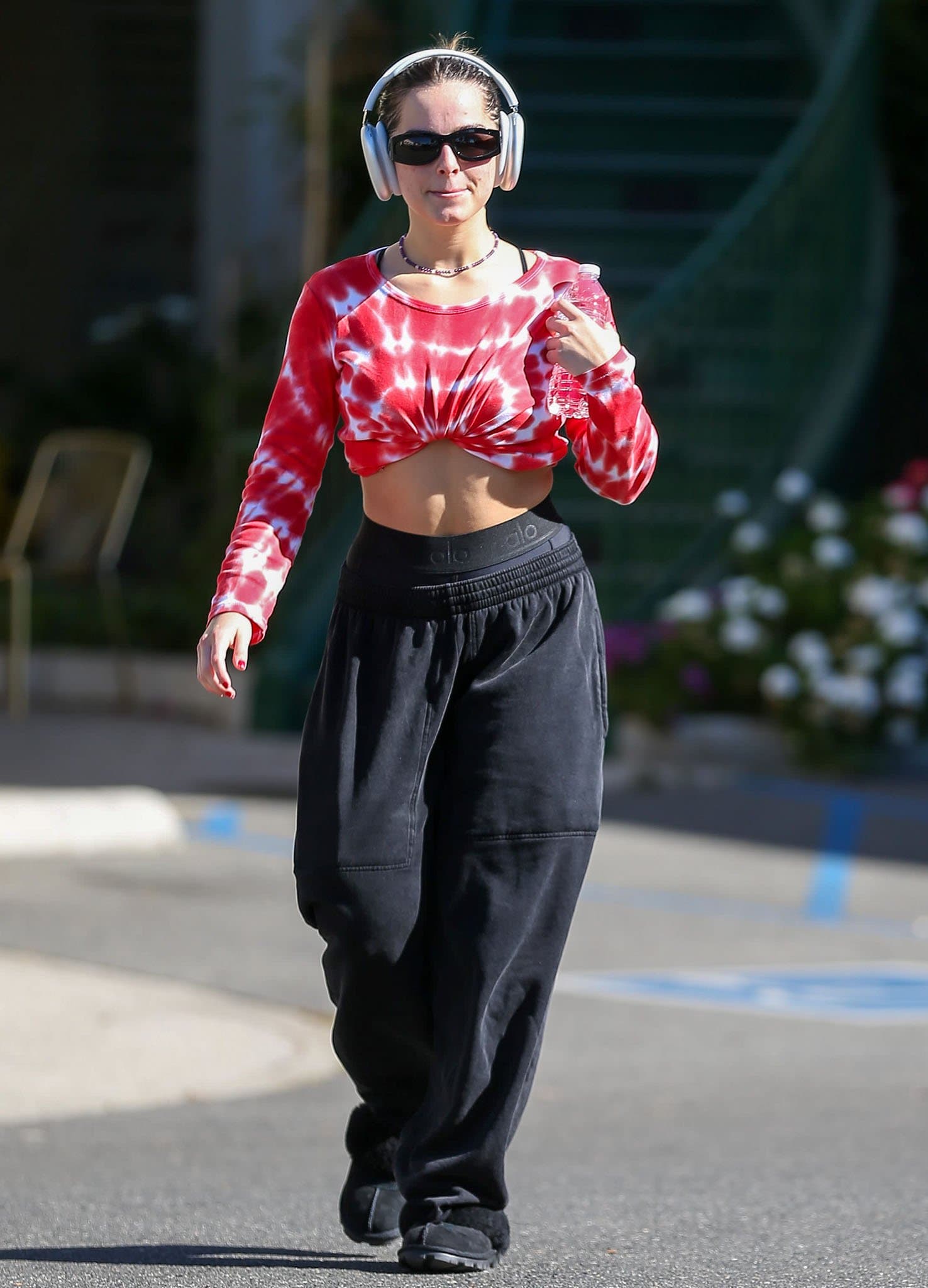 Addison Rae opts for '90s athleisure in a Réalisation tie-dye crop top and baggy sweatpants