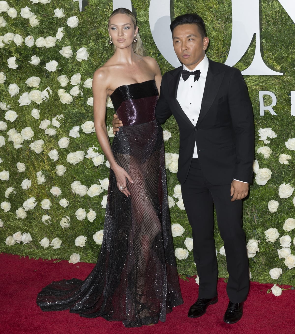 Candice Swanepoel in Prabal Gurung, posing with the fashion designer at the Tony Awards