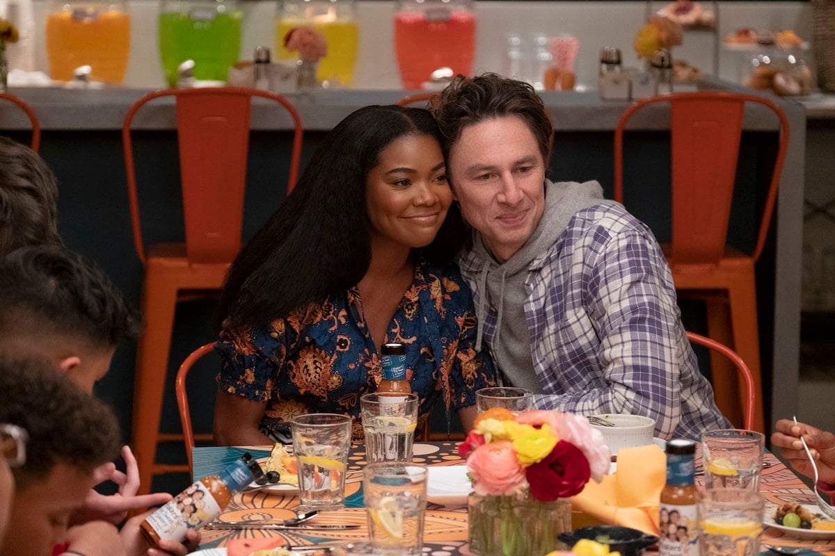 Gabrielle Union and Zach Braff star as Zoe and Paul Baker, parents of a modern blended family, in Disney’s 2022 remake of Cheaper by the Dozen