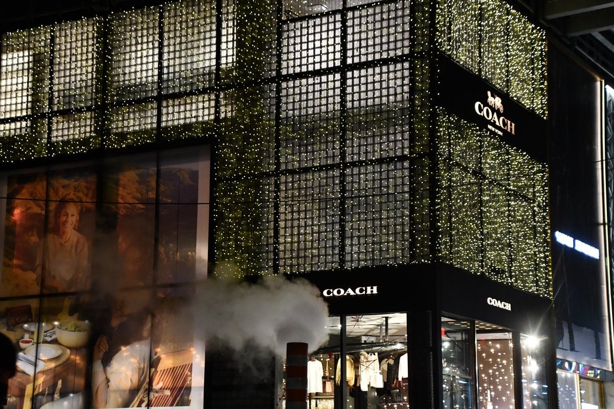 The illuminated Coach flagship store at the corner of 54th Street in New York City is a must-see destination for fashion lovers and tourists alike
