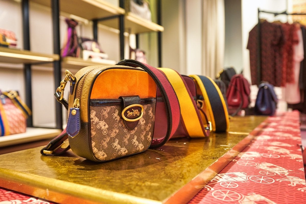 Coach handbags featuring the signature Horse and Carriage motif — a timeless emblem of the brand’s New York heritage