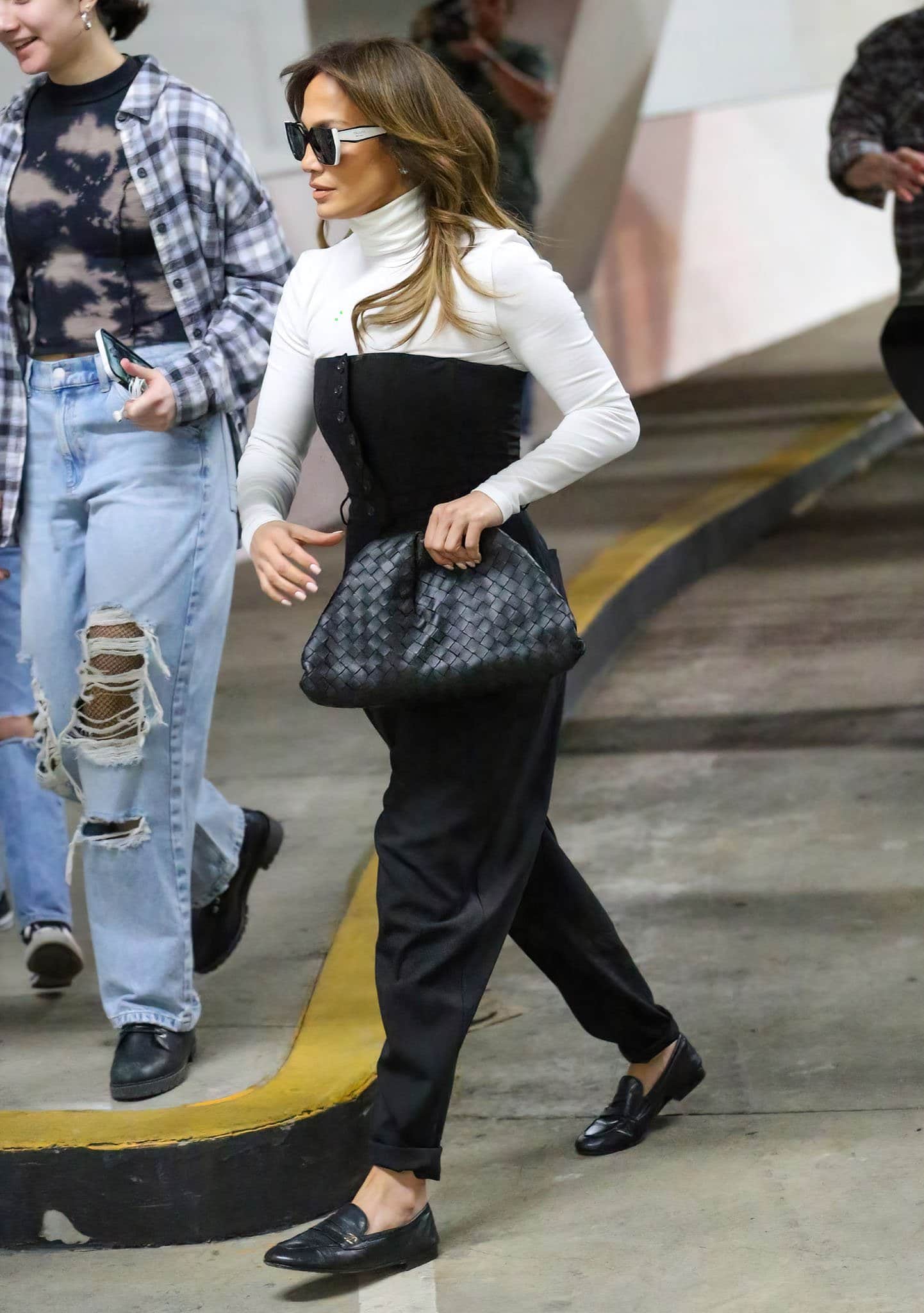 Jennifer Lopez channels inner boss lady in white Wolford turtleneck top and Dolce Gabbana strapless bustier jumpsuit