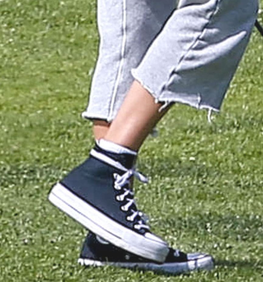 Jessica Alba completes her golf look with Converse Chuck Taylor sneakers