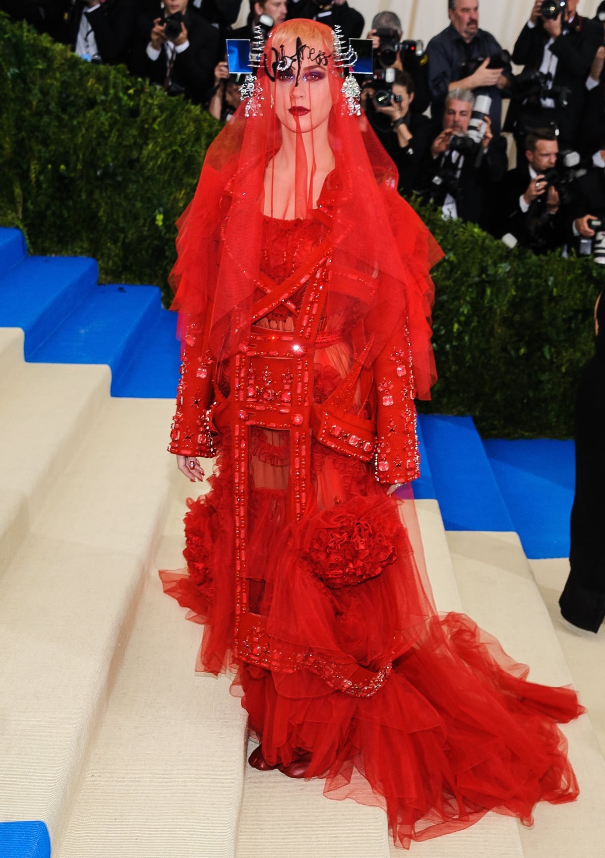 Katy Perry made a dramatic entrance in a red Maison Margiela Spring 2017 Couture gown at the “Rei Kawakubo/Comme des Garçons: Art of the In-Between” Costume Institute Gala on May 1, 2017, at the Metropolitan Museum of Art in New York City