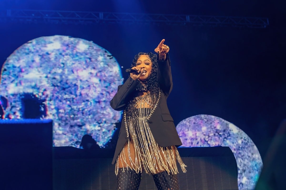 Rapper Trina (Katrina Laverne Taylor) lit up the stage in a sparkling fringe bodysuit layered under a sharp black blazer, pairing the bold look with studded tights for a fierce and commanding performance