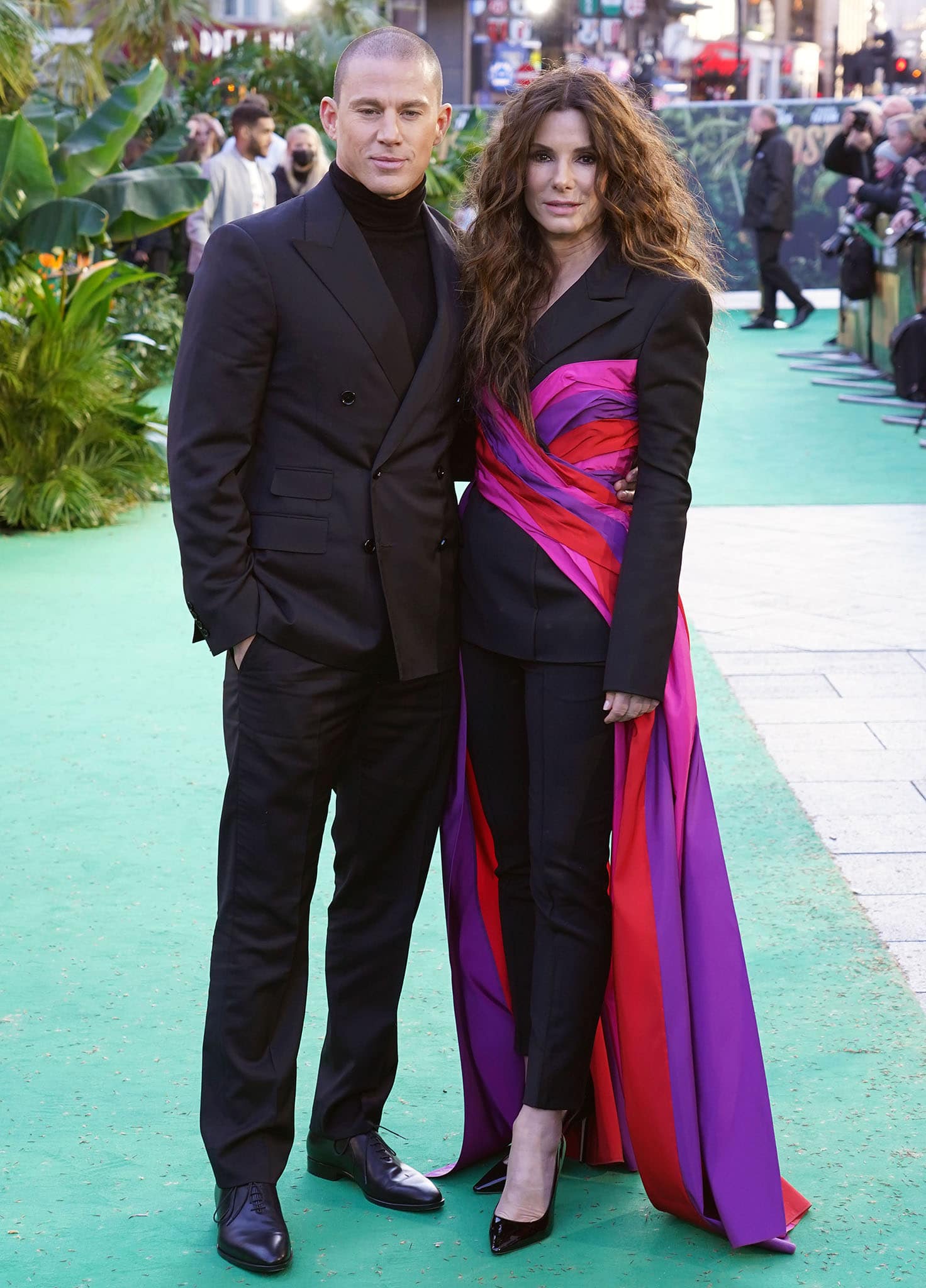 Channing Tatum wears a sleek all-black Ralph Lauren ensemble featuring a double-breasted suit, turtleneck sweater, tailored slacks, and polished dress shoes
