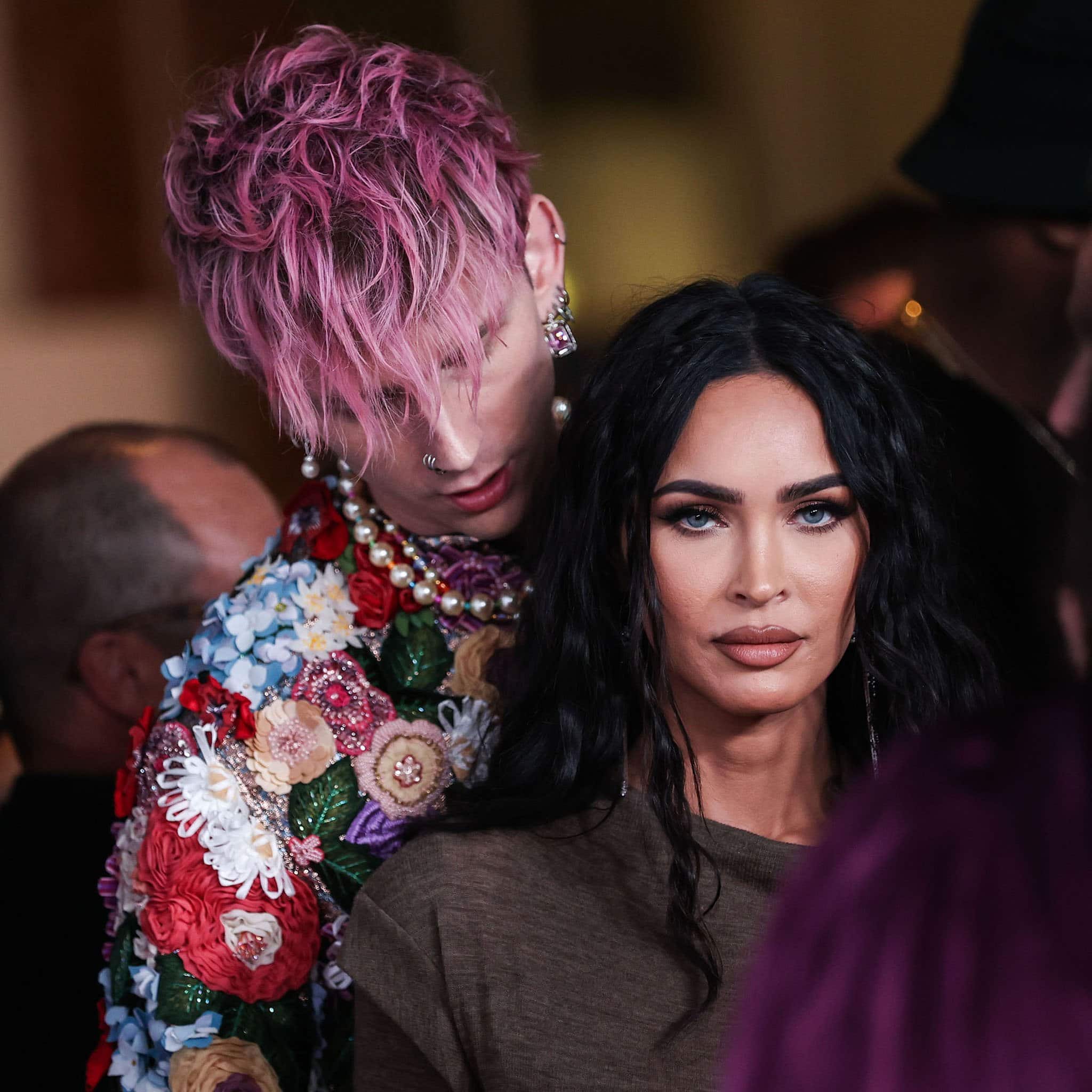 Megan Fox seems not in the mood for some red-carpet PDA with her fiancé, Machine Gun Kelly