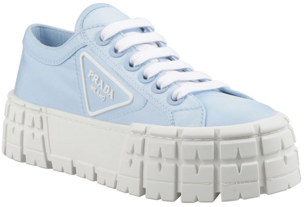 These Prada ‘Double Wheel’ sneakers are characterized by the thick, ridged platform soles and side logo patch