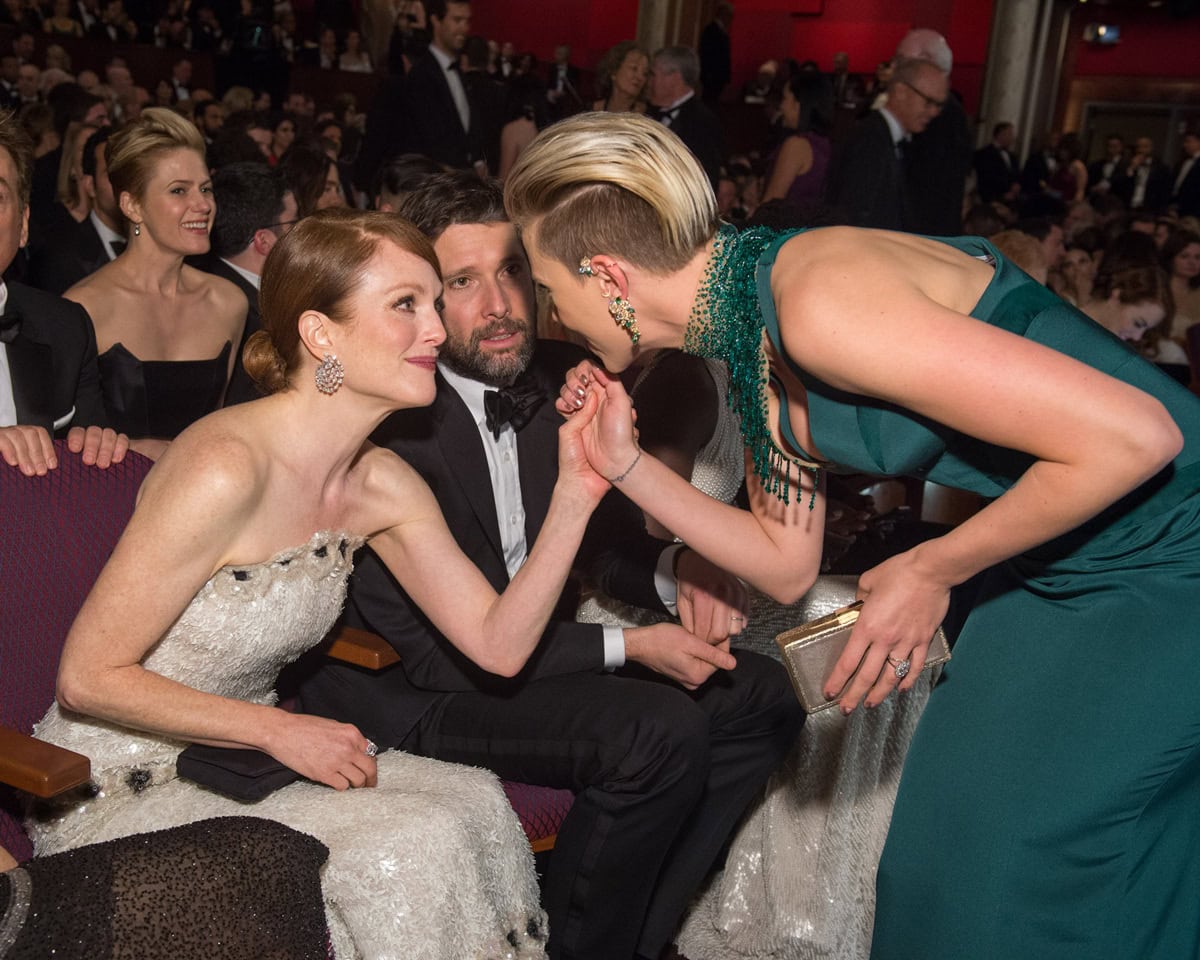 Scarlett Johansson’s Swarovski-embroidered Atelier Versace collar and sculptural Piaget ear cuff drew attention as she greeted Best Actress winner Julianne Moore inside the 2015 Academy Awards ceremony