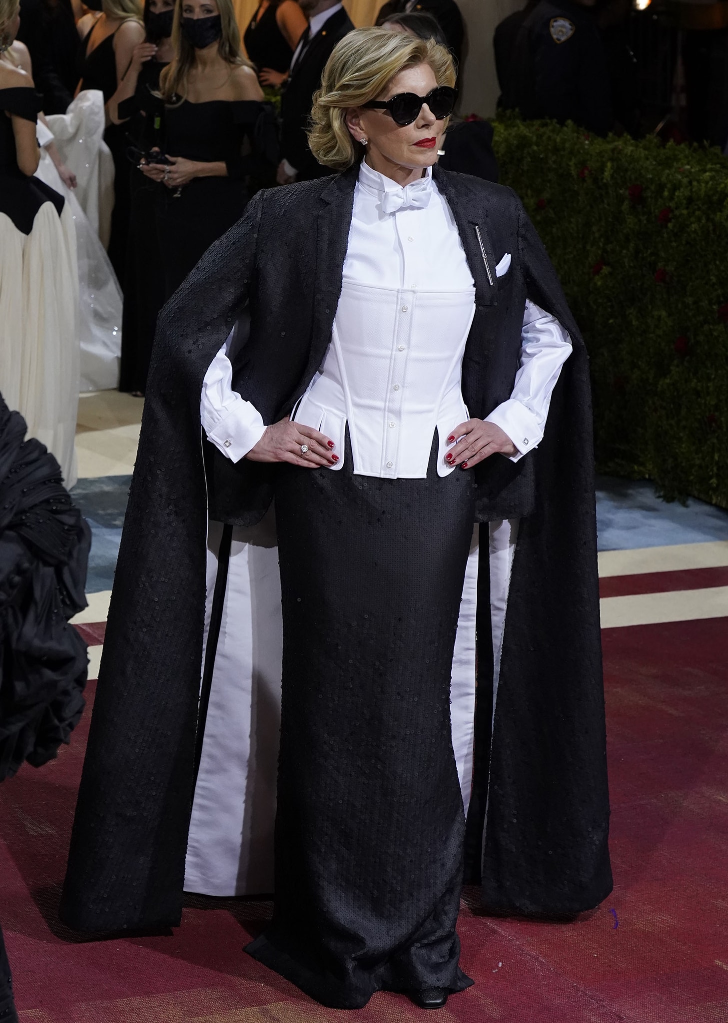 Christine Baranski exudes timeless elegance in a stately Thom Browne ensemble, pairing a sharply tailored corset suit with understated black heels that subtly elevate her commanding 5ft 8½ frame