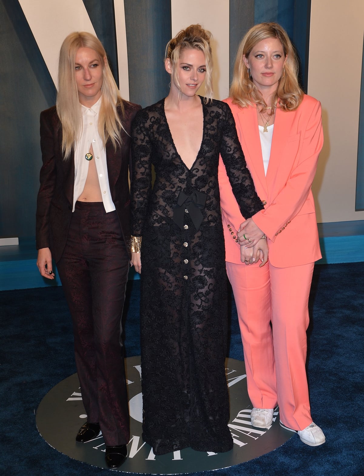 Kristen Stewart in a sheer Chanel gown with Dylan Meyer and a friend at the 2022 Vanity Fair Oscar Party