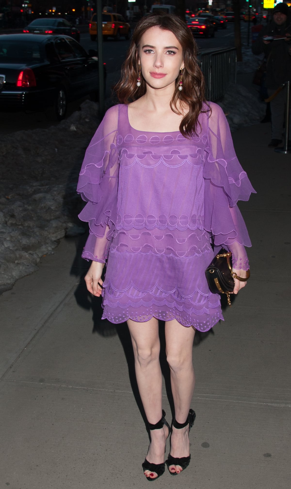 Emma Roberts balances a ruffled lavender Chloé mini with black platform sandals and a Chloé Nile bracelet bag at The Blackcoat’s Daughter screening in New York City