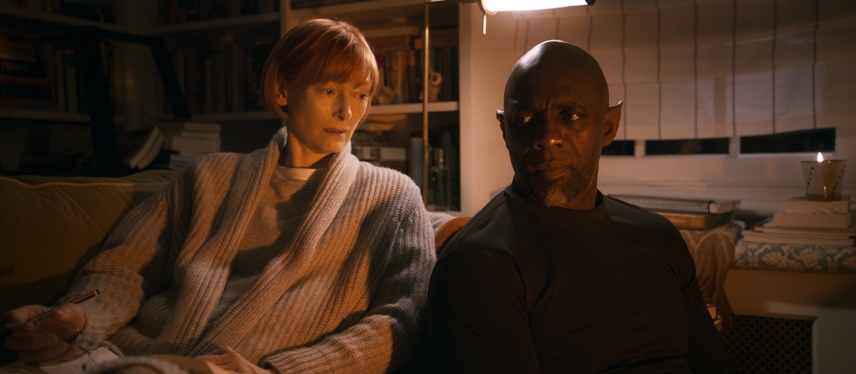 Tilda Swinton as scholar Alithea Binnie sits beside Idris Elba’s Djinn in a scene from George Miller’s Three Thousand Years of Longing