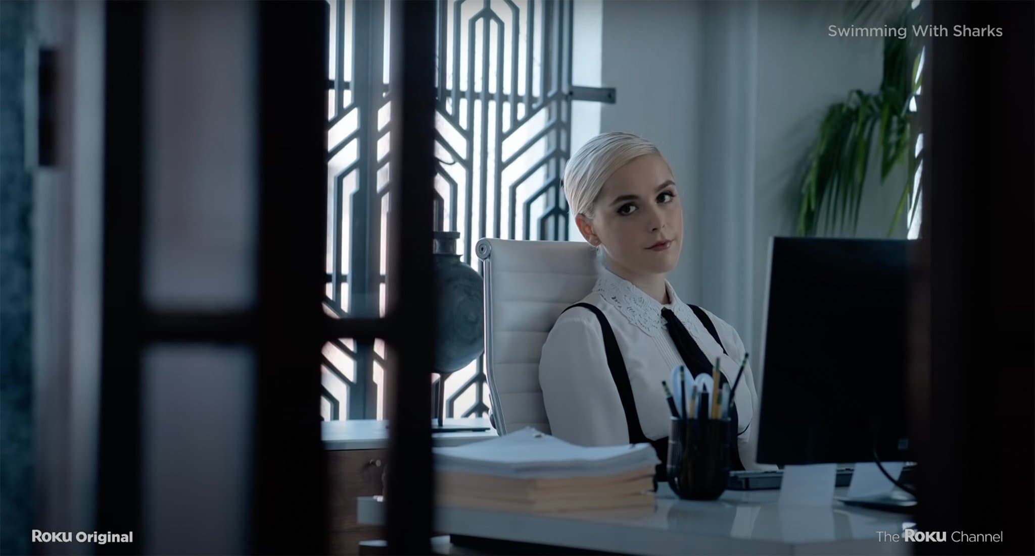 Kiernan Shipka stars as a young female assistant who is at the center of a studio filled with manipulators, schemers and intrigue in the new Roku miniseries Swimming with Sharks