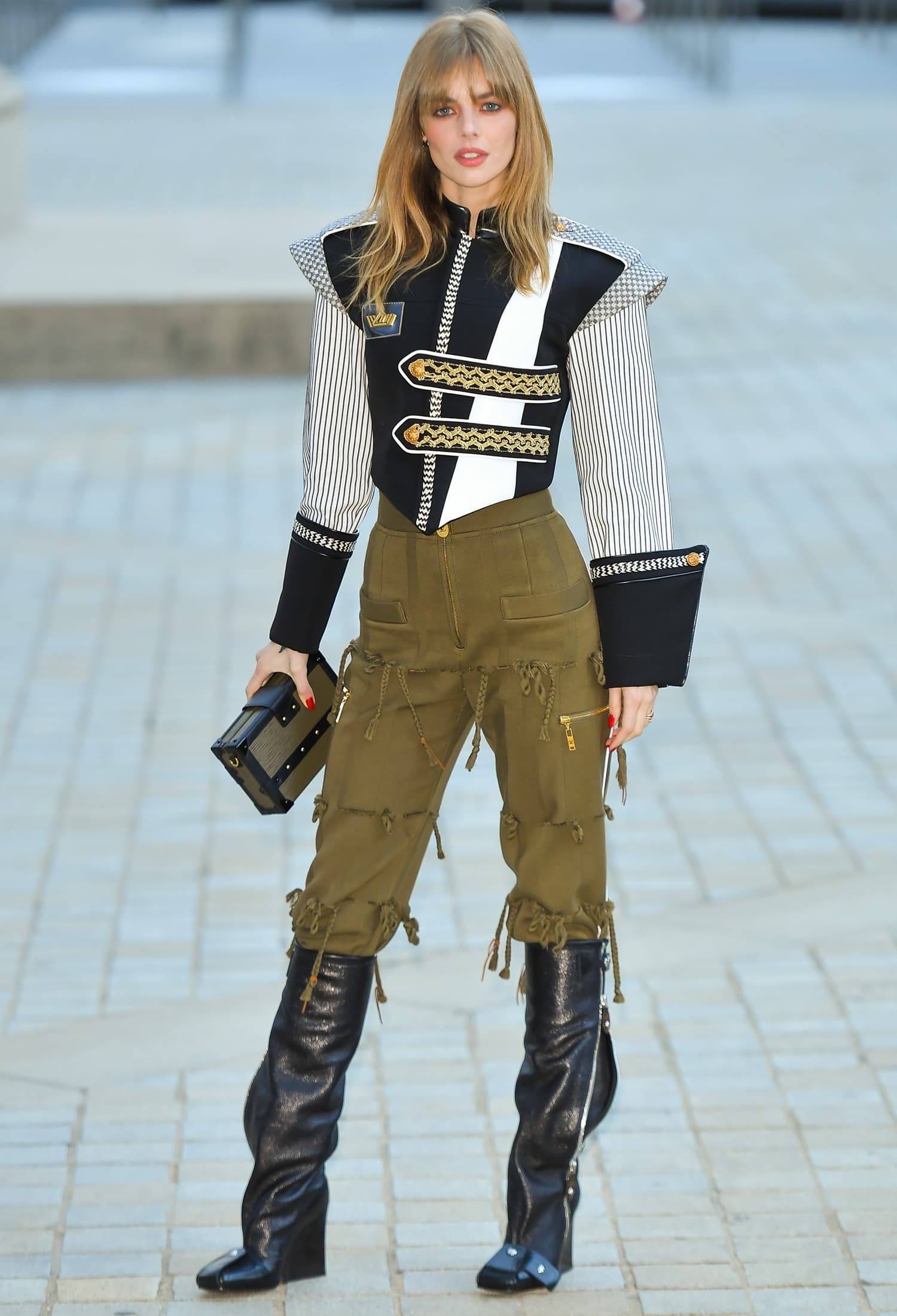 Samara Weaving steps out in statement black Louis Vuitton boots with a chunky lug sole and pointed toe, grounding her structured, military-inspired ensemble with a sharp, utilitarian edge at the Louis Vuitton Cruise 2020 Fashion Show