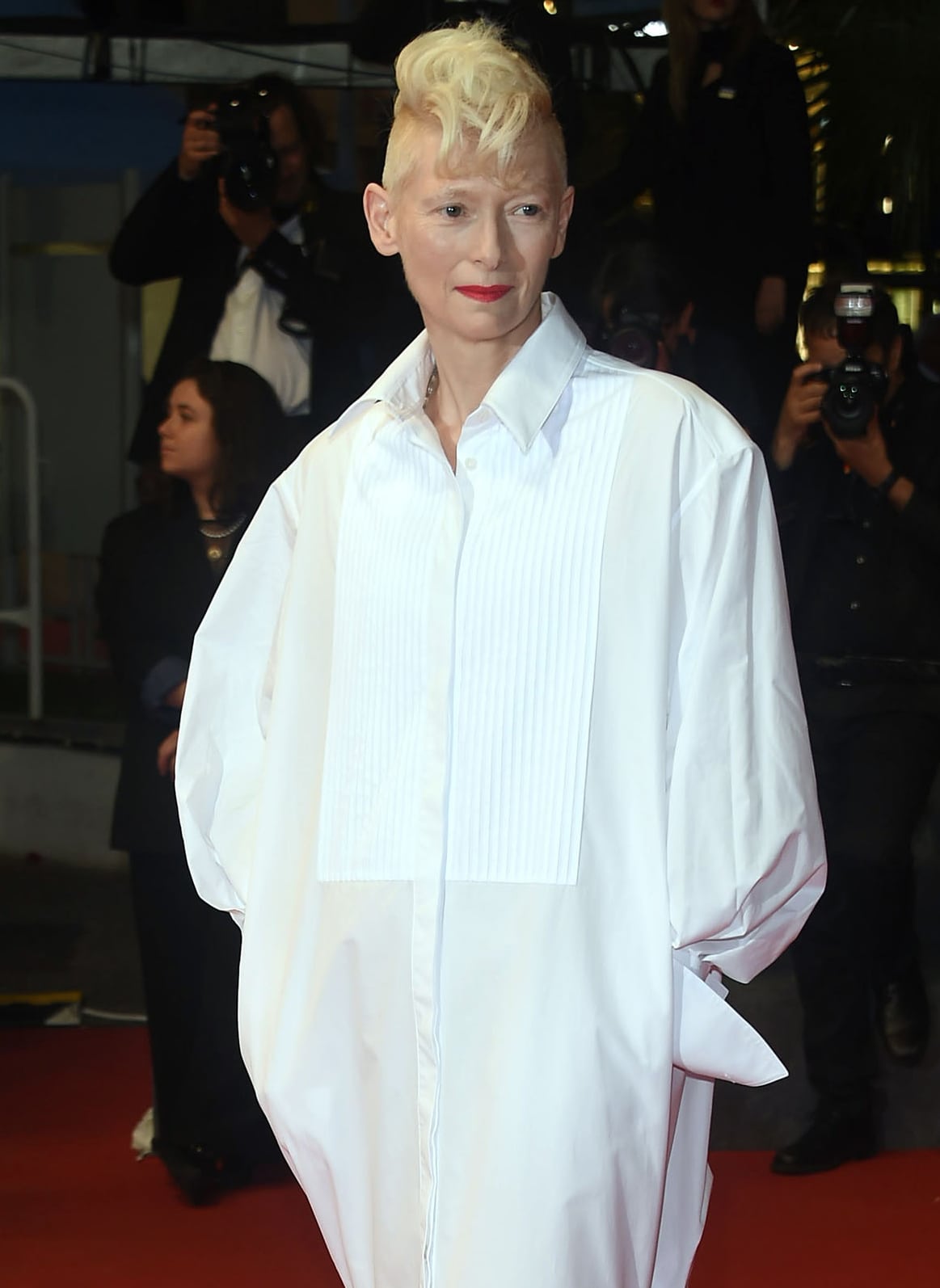 The pleated bib front and exaggerated proportions transform Swinton’s crisp white Alaïa shirt dress into a sculptural alternative to a conventional Cannes evening gown