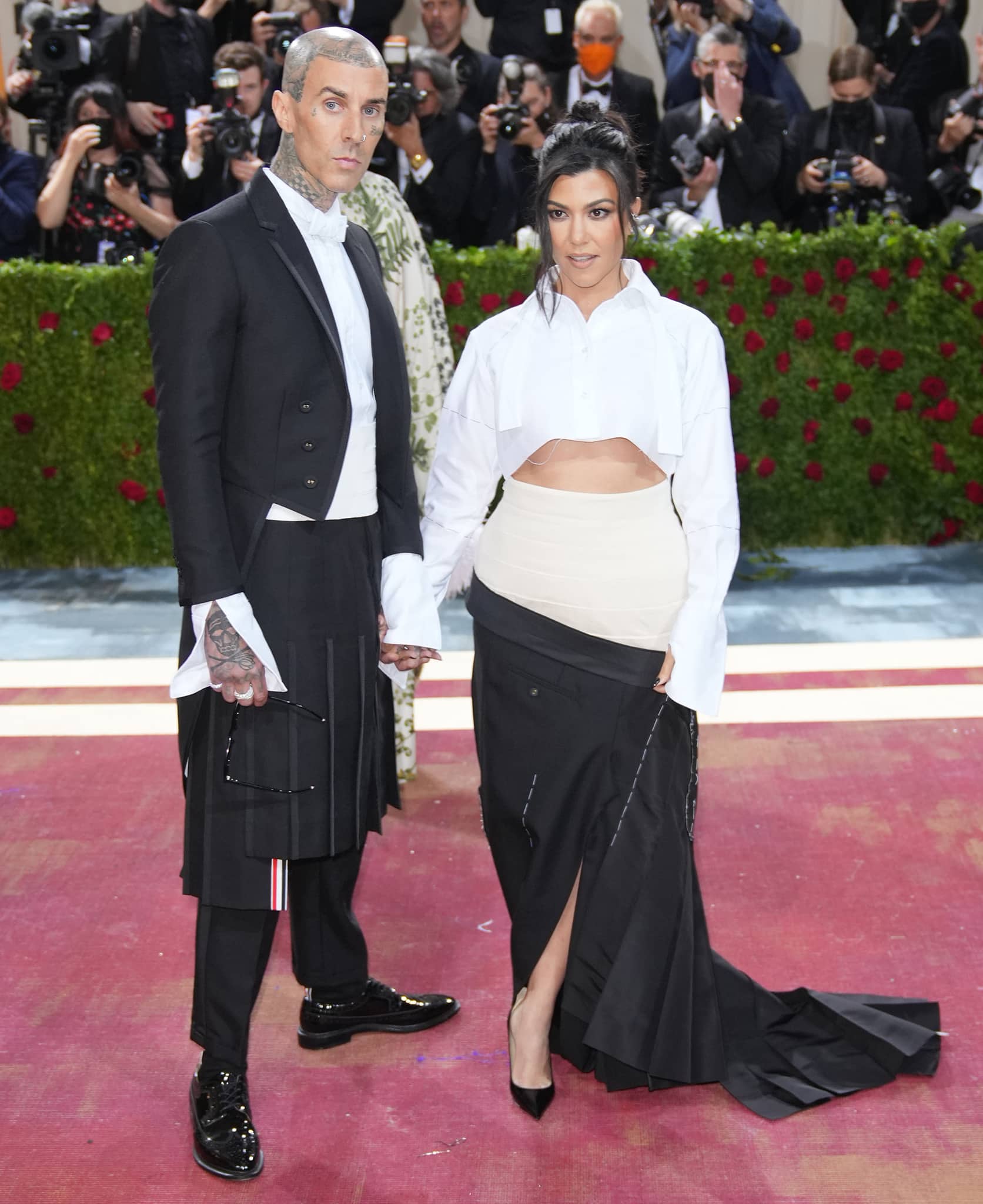 Travis Barker and Kourtney Kardashian coordinate in custom Thom Browne designs as they make their Met Gala debut
