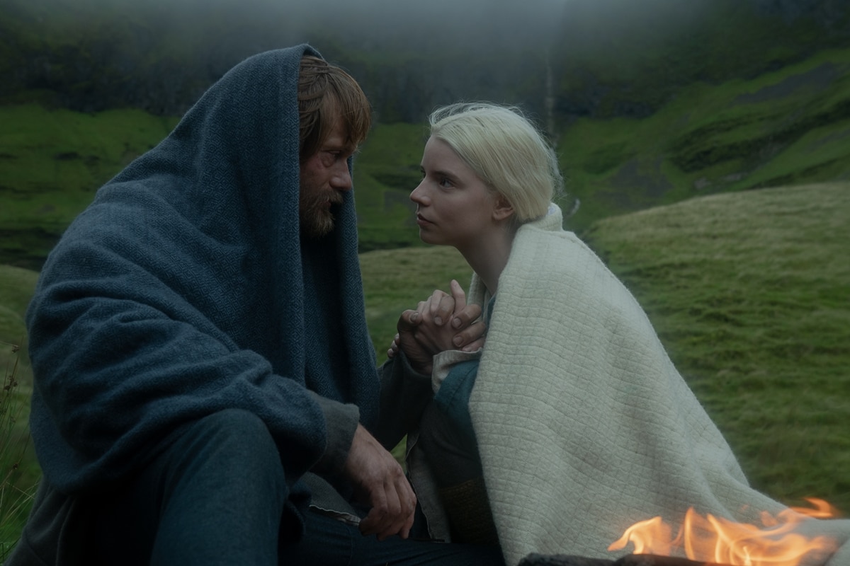 Anya Taylor-Joy transforms into mystical healer Olga in The Northman, wrapped in layered Nordic knits and wool cloaks—her ethereal look blending seamlessly into the film’s raw, windswept landscapes