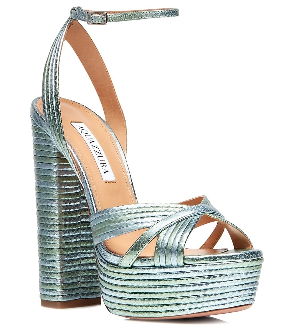 Crafted in metallic snake-effect leather, Aquazzura's "Sundance" sandals combine crisscross toe straps, a chunky platform sole, and a soaring block heel for one of the brand's most recognizable red-carpet silhouettes