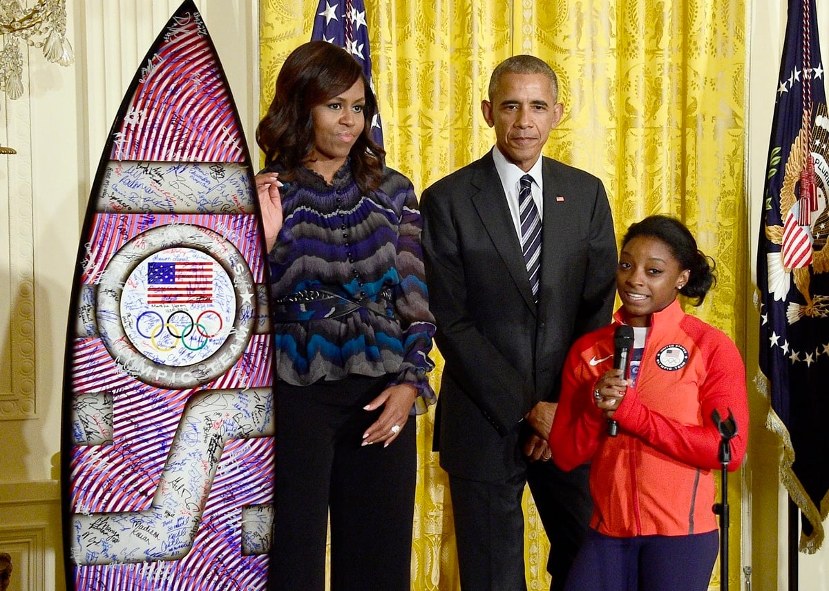 Simone Biles looks tiny next to Michelle and Barack Obama during an East Room event at the White House
