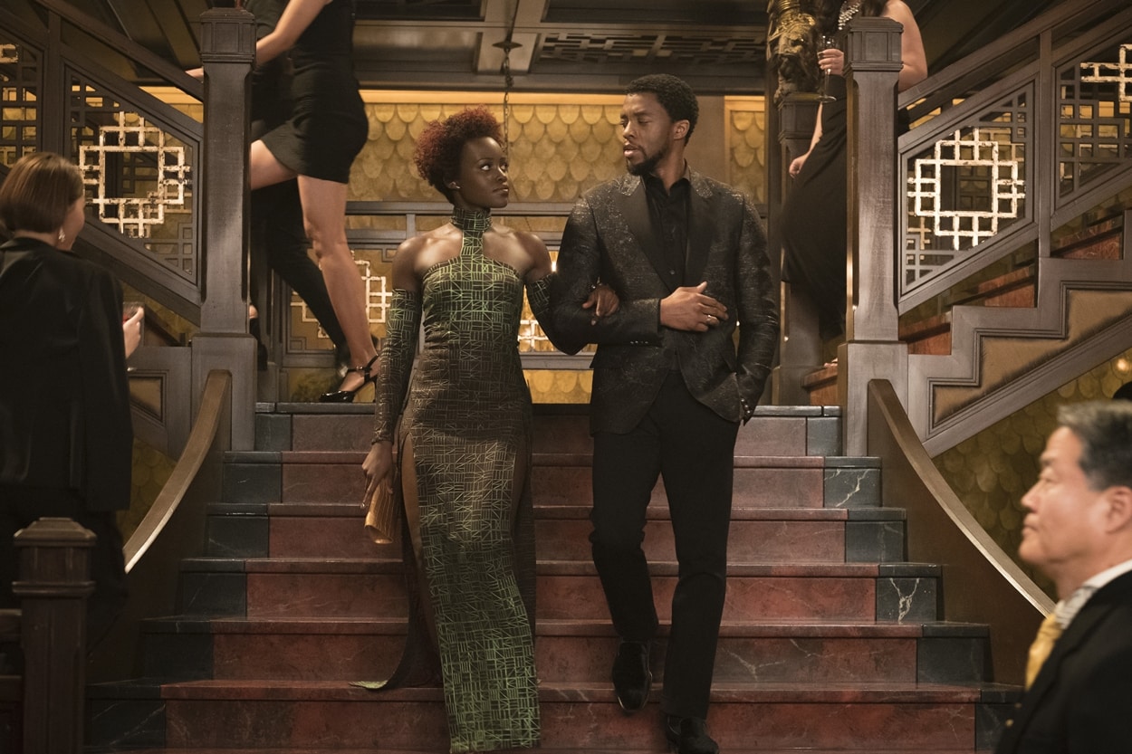 Lupita Nyong’o walks arm in arm with Black Panther co-star Chadwick Boseman, whose regal screen presence as T’Challa remains enduring following his passing in August 2020