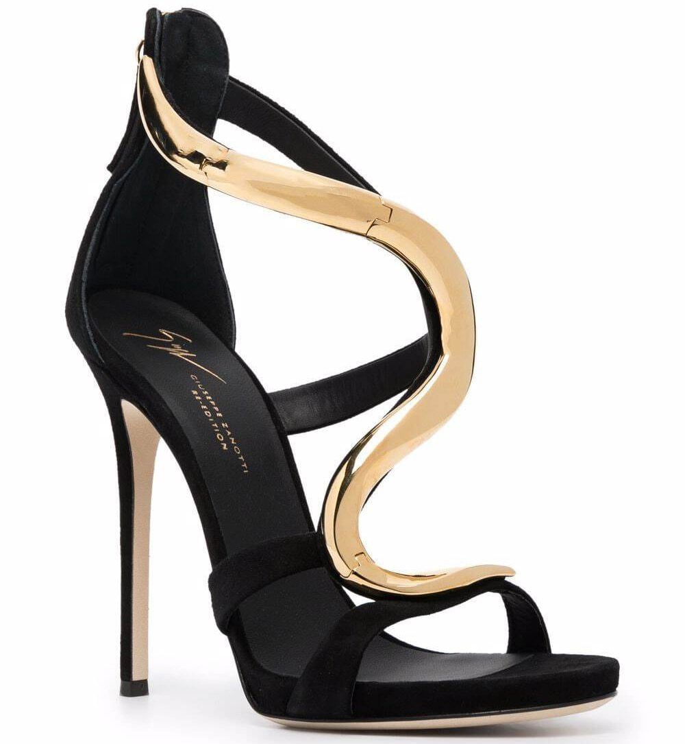 The Giuseppe Zanotti Venere sandal features a striking gold serpent-like detail that elegantly wraps around the foot, embodying bold luxury and Italian craftsmanship
