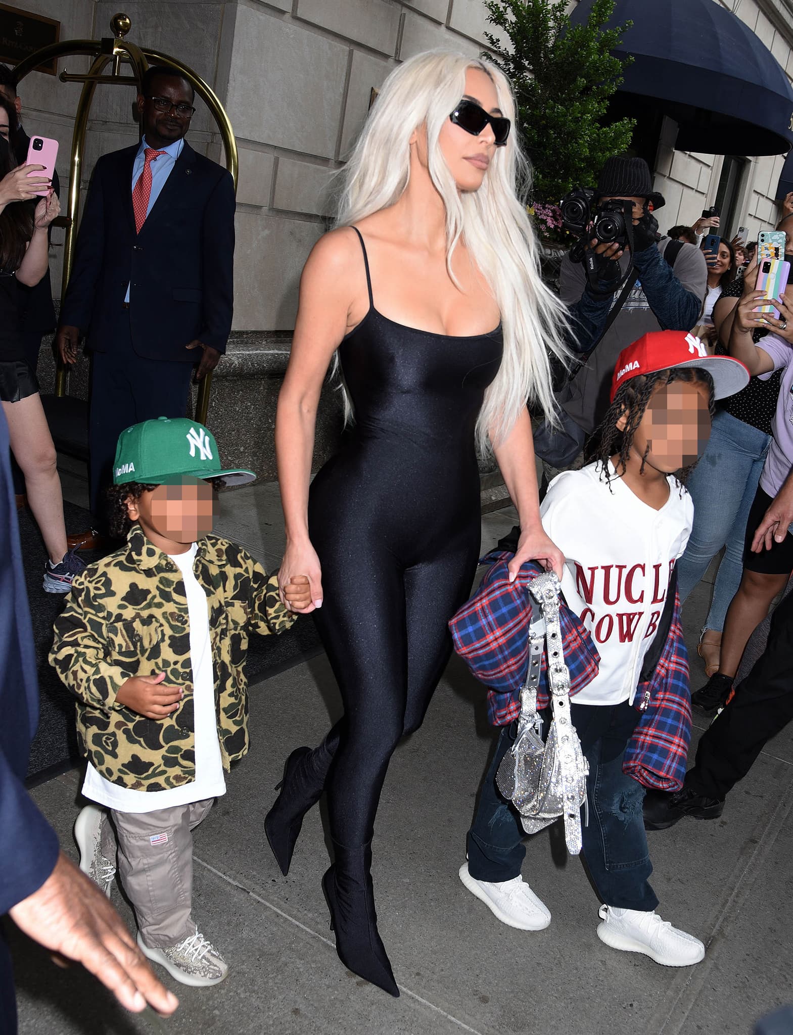 Kim Kardashian steps out in a skintight Balenciaga bodysuit paired with the brand’s sharp black ankle boots while heading to The Tonight Show Starring Jimmy Fallon to promote SKKN by Kim