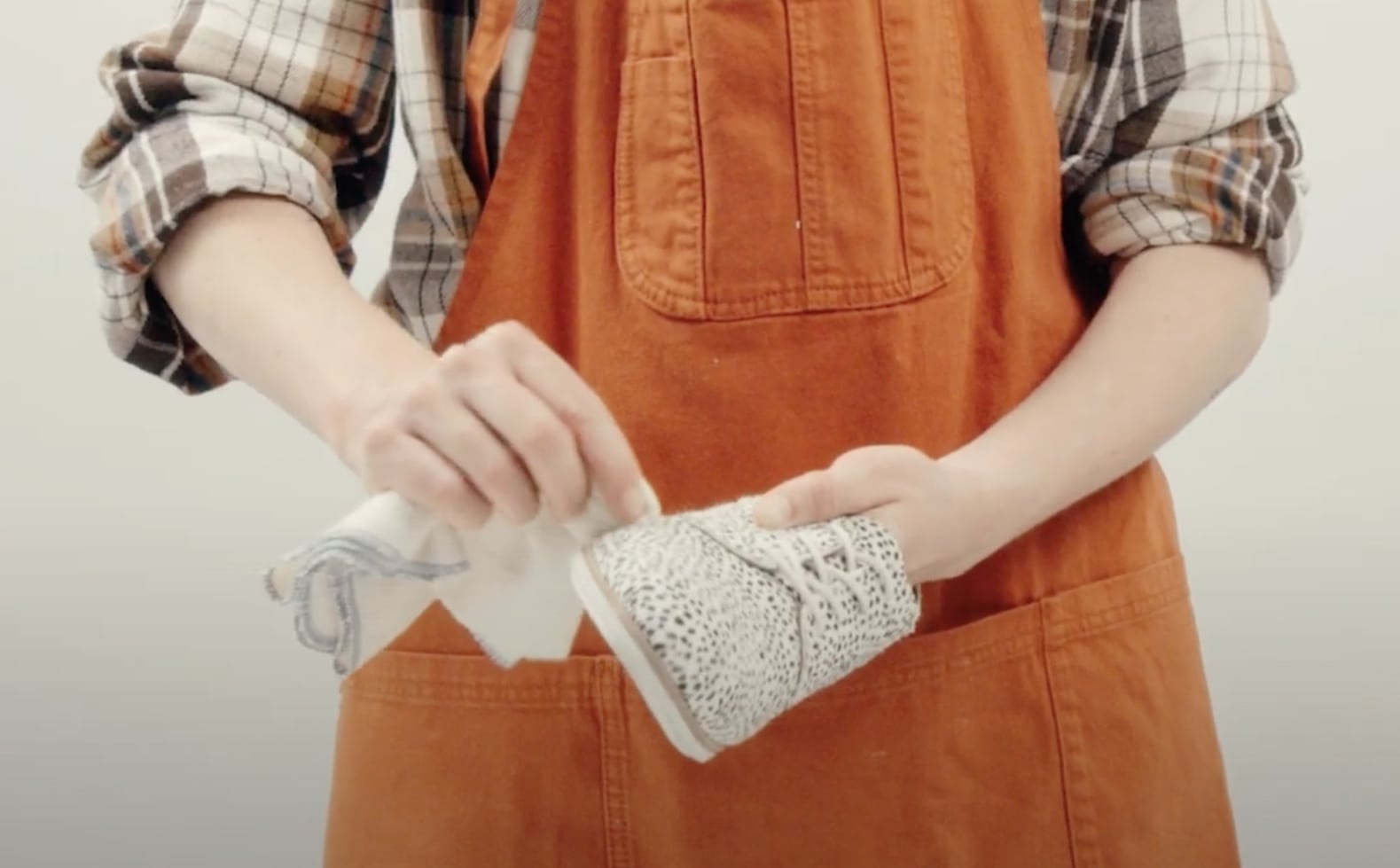 Use a clean, damp cloth to gently wipe away dirt and stains from your calf hair shoes, ensuring you don’t oversaturate the material