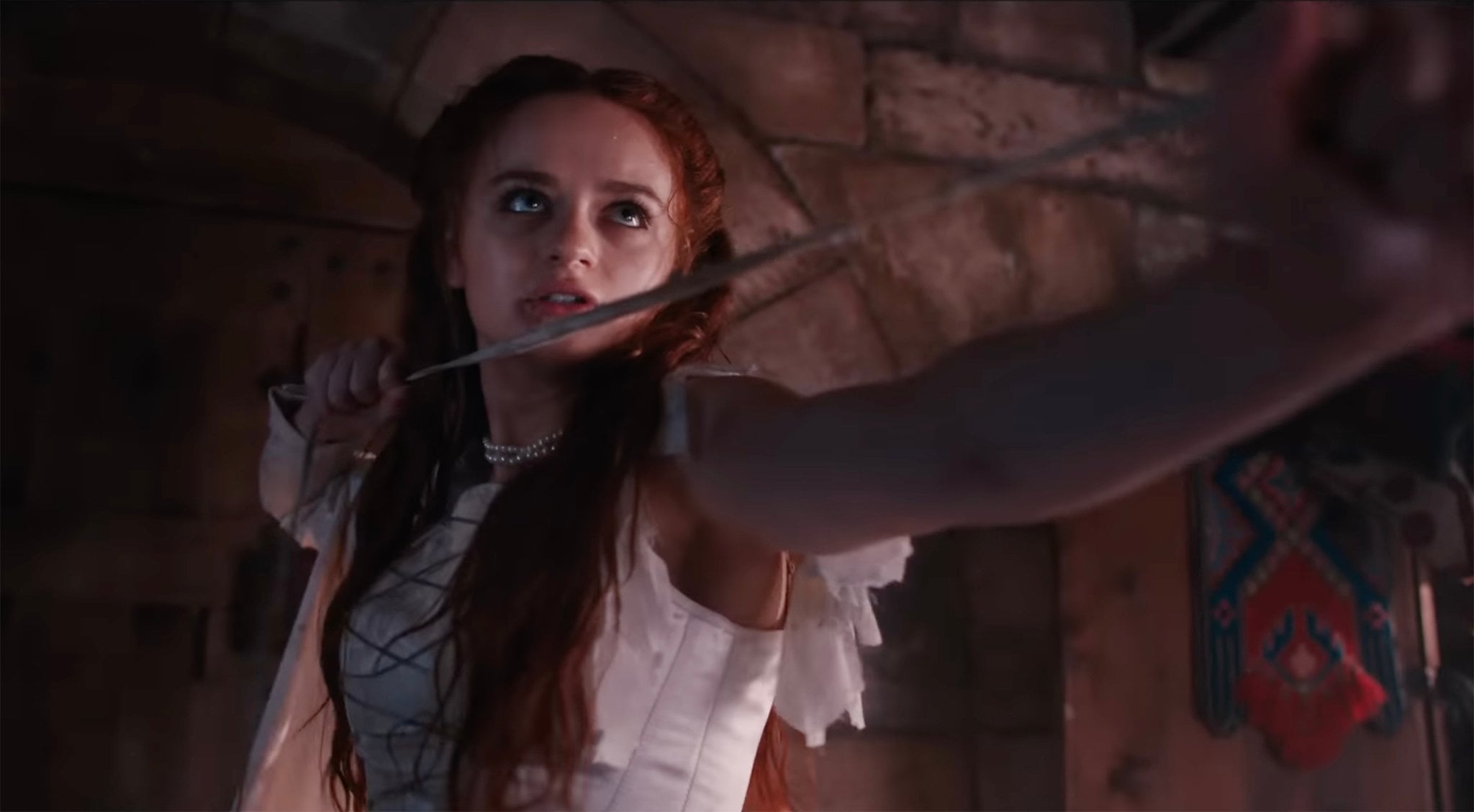 Joey King wields a sword as the fierce titular heroine in Hulu’s action thriller The Princess, directed by Le-Van Kiet
