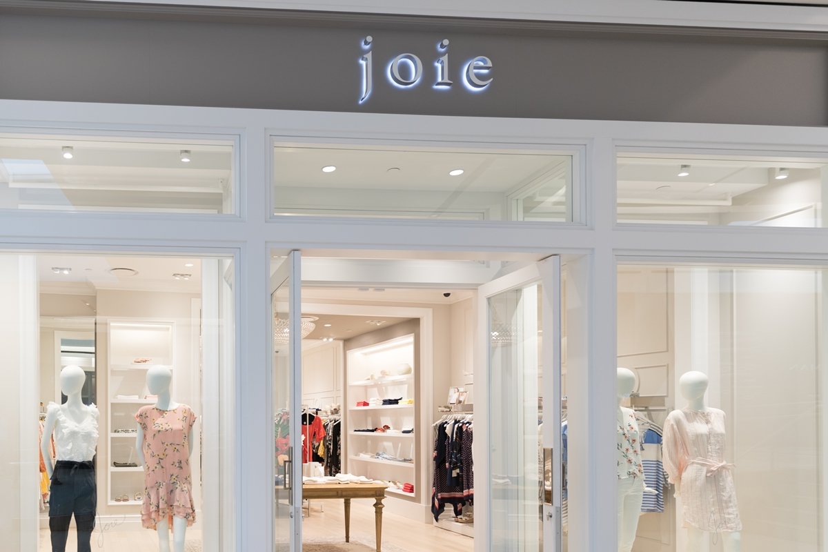 Exterior of a Joie boutique in Philadelphia, showcasing the brand’s signature mix of feminine, effortless clothing displayed in a light, airy retail space