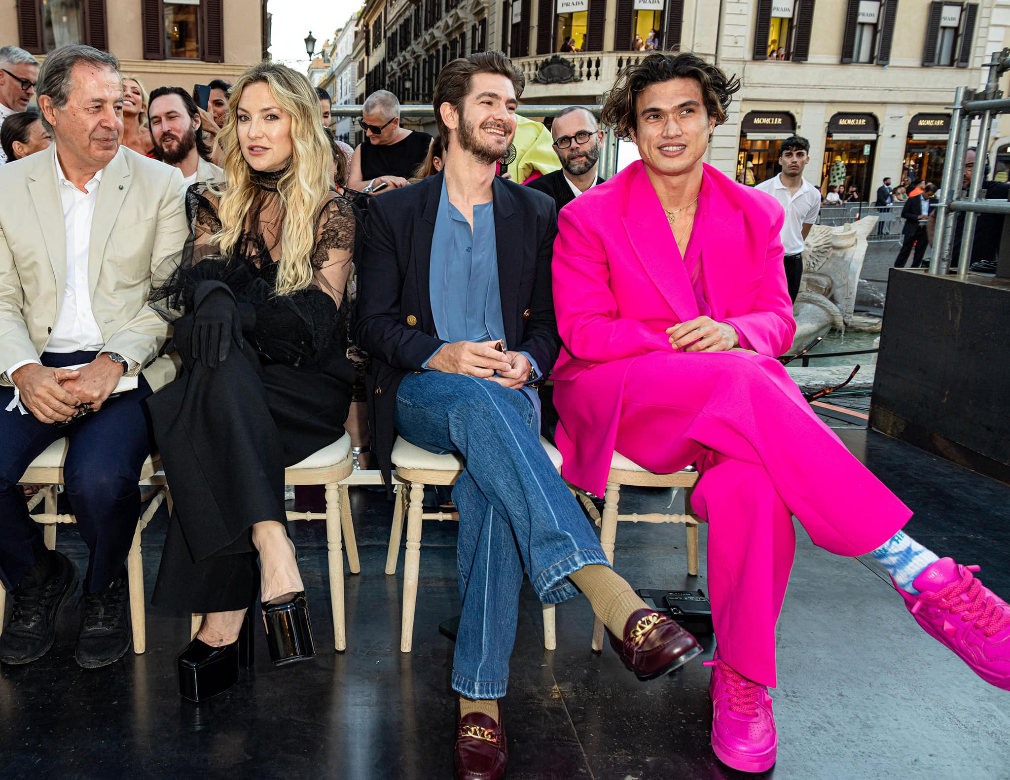 Kate Hudson sits front row at the Valentino Haute Couture show in Rome alongside Andrew Garfield and Charles Melton, pairing her sheer lace ensemble with towering black platform pumps