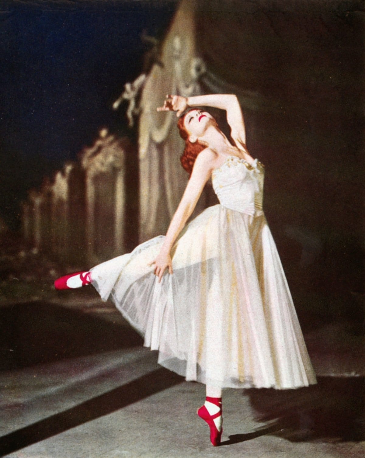 Moira Shearer enchants as ballerina Victoria Page, dancing in the cursed red pointe shoes that blur art and obsession in the 1948 classic The Red Shoes