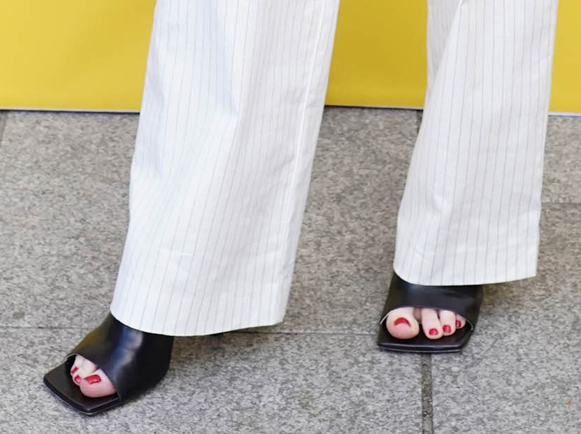 Balenciaga square-toe mules added a contemporary edge to Nicola Roberts' tailored separates while subtly showcasing her red pedicure