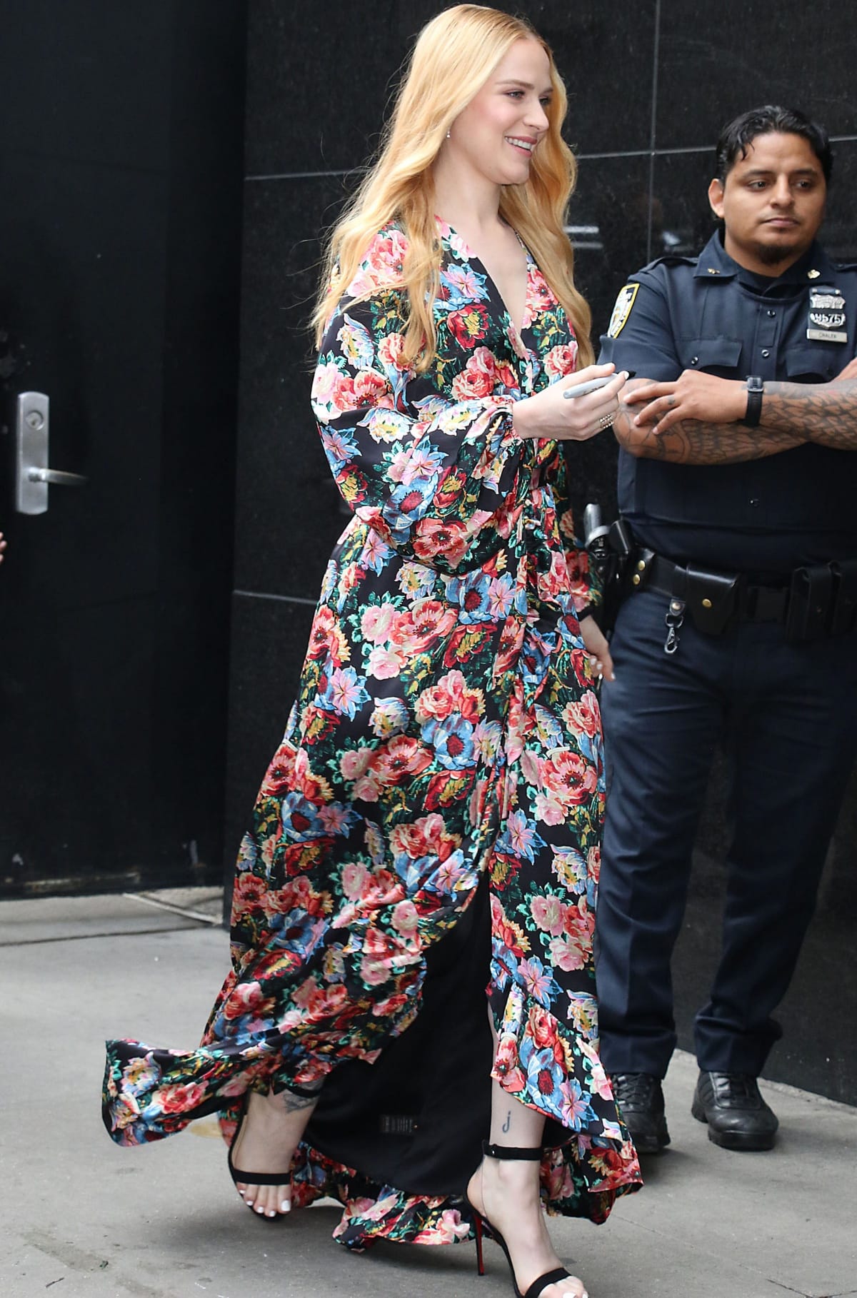 Evan Rachel Wood stuns in a vibrant floral maxi dress paired with sleek black Christian Louboutin ankle-strap heels, exuding effortless elegance