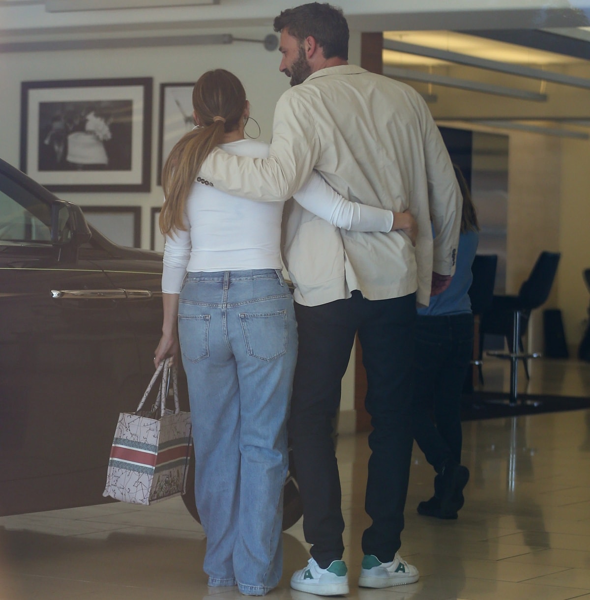 Ben Affleck wrapped his arm around his fiancée Jennifer Lopez as they looked around the Rolls-Royce dealership in Los Angeles