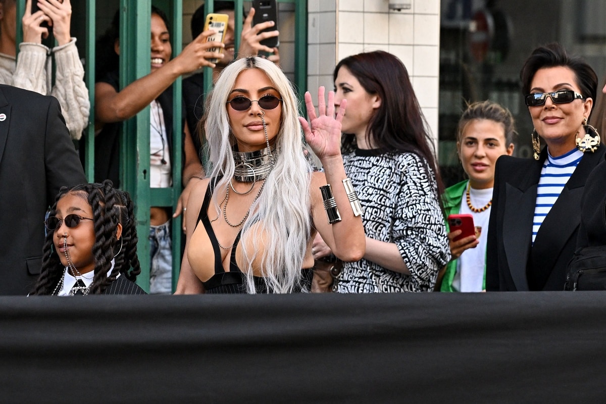 North West and Kim Kardashian wear matching faux nose rings with Kris Jenner in a striped shirt and a boxy blazer