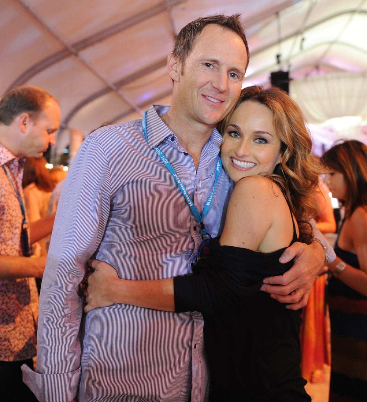 Giada De Laurentiis cozies up to then-husband Todd Thompson at the 2011 South Beach Wine Food Festival, glowing in an off-the-shoulder black dress with voluminous curls and her signature radiant smile