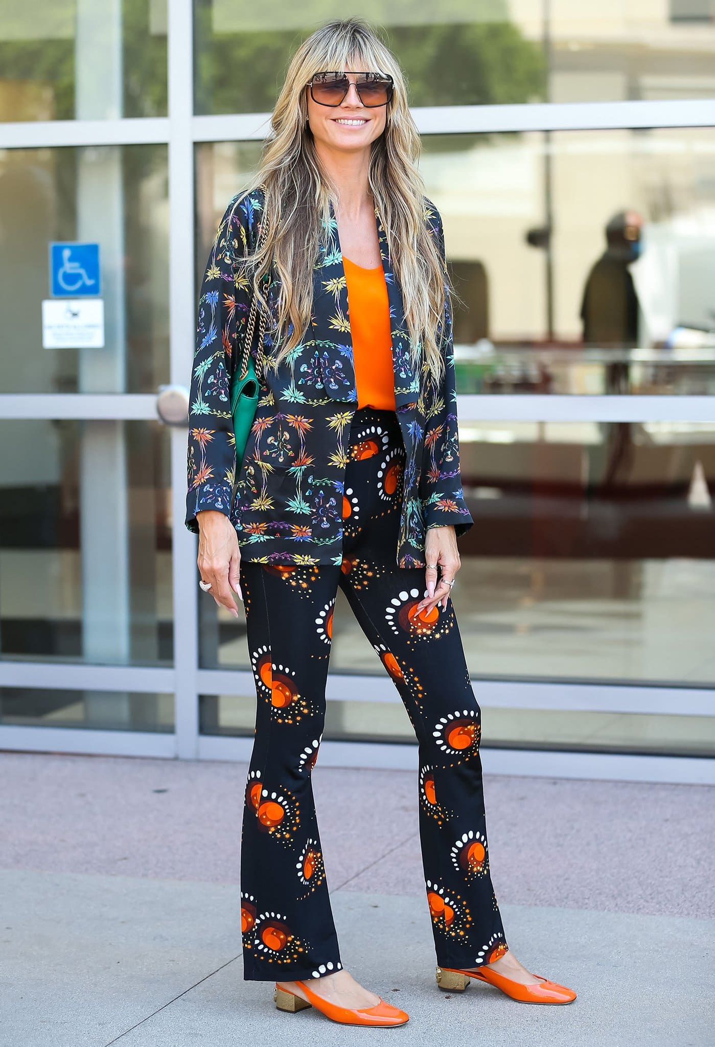 Heidi Klum arriving at the Sheraton Pasadena Hotel in a bold, printed ensemble for the AGT Third Qualifiers Results Show on August 24, 2022