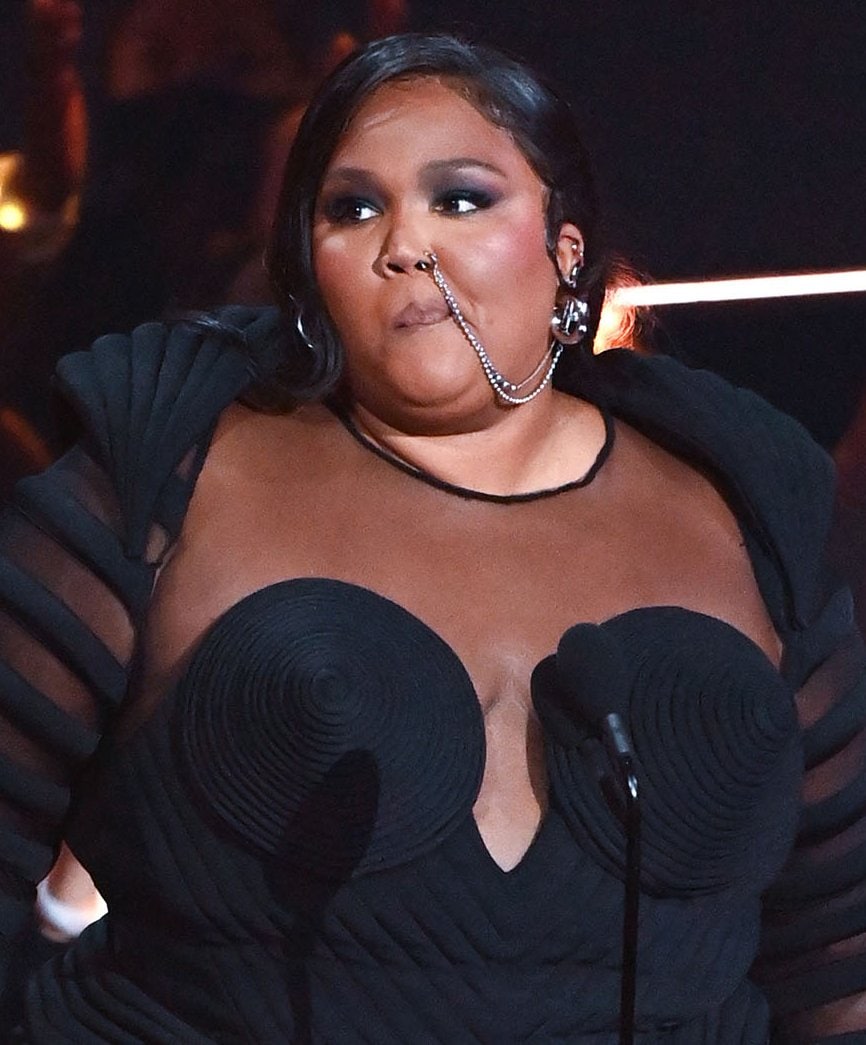 Lizzo adds punk element to her look with a nose chain ring and smokey eye-makeup