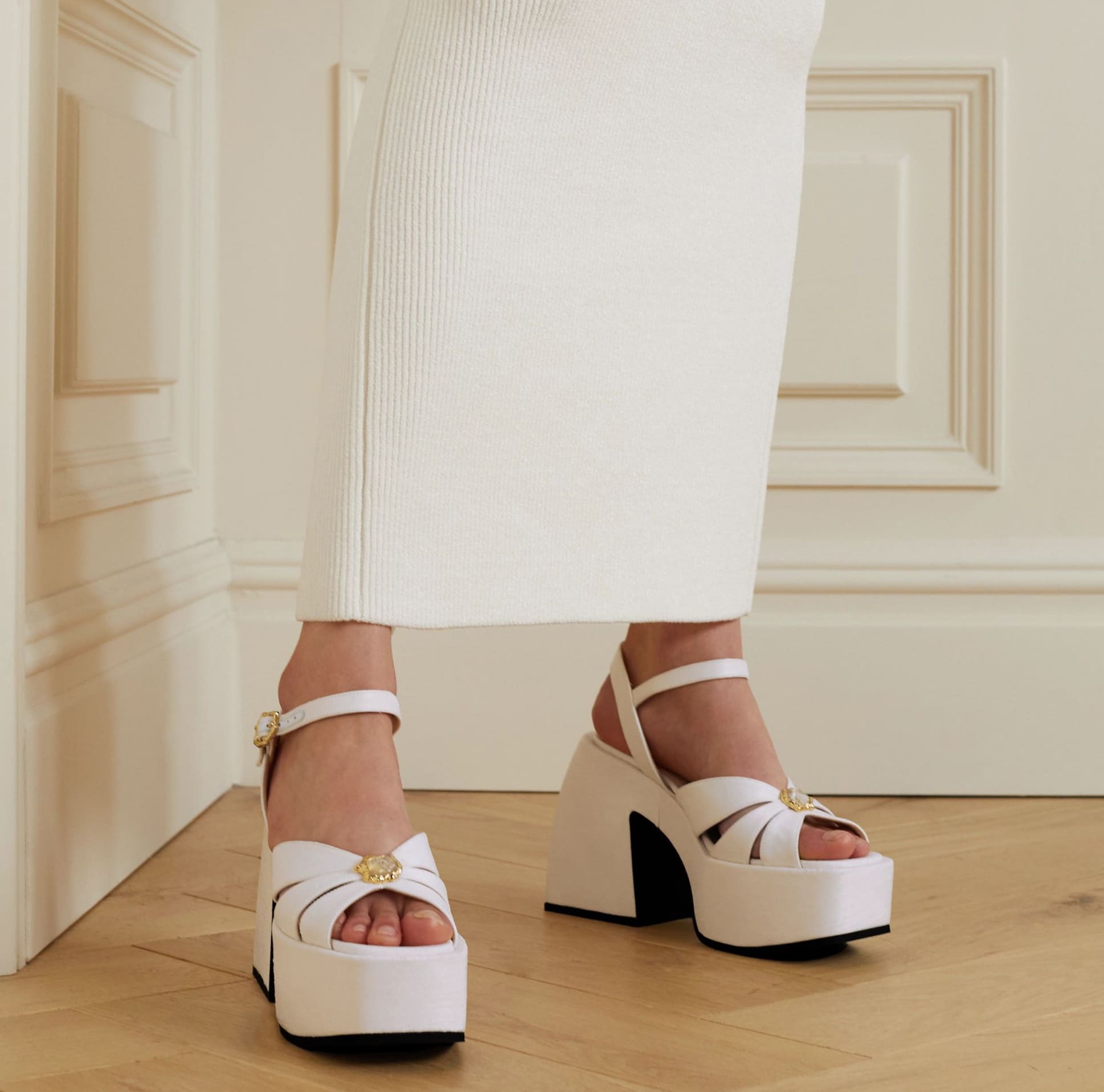 The Nodaleto Bulla Aurora sandals sit atop the brand’s signature chunky Bulla heels, combining a high platform base with sculptural block heels for maximum impact