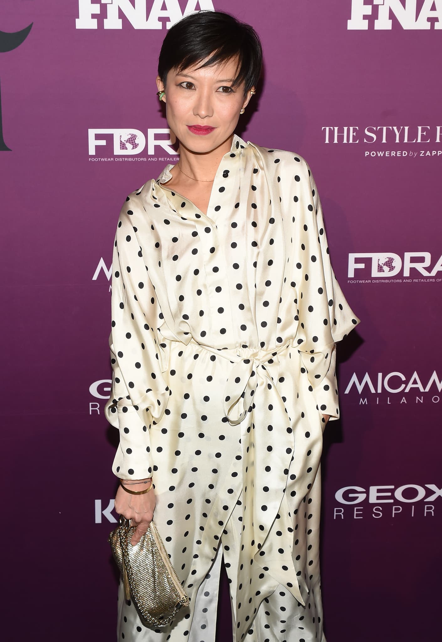 Sandra Choi, creative director of Jimmy Choo, attends the FN Achievement Awards in a silky polka-dot ensemble paired with a metallic clutch