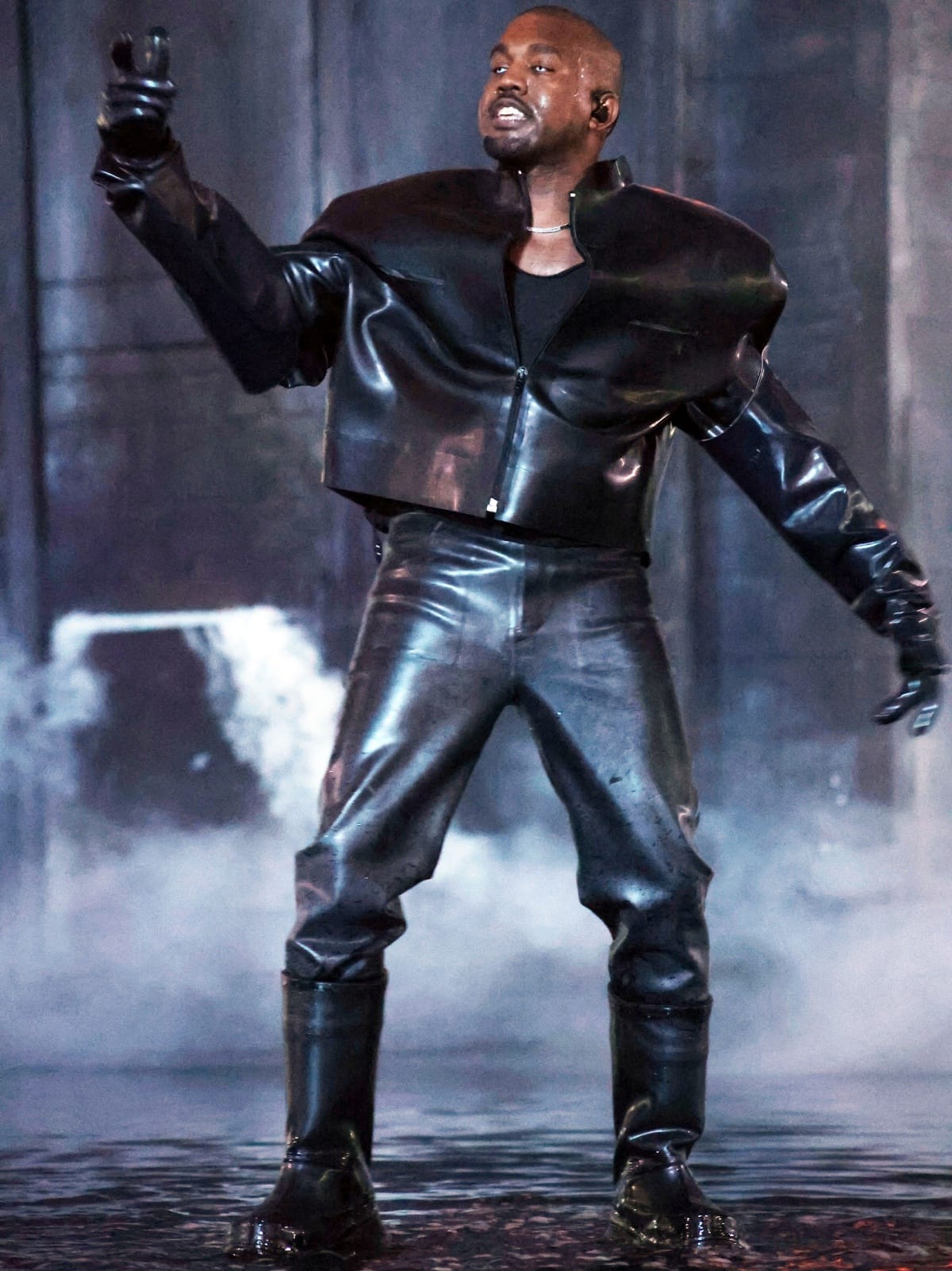Kanye West makes a dramatic appearance at the Donda 2 Listening Party at LoanDepot Park in Miami on February 23, 2022, dressed head-to-toe in sculptural black leather with heavy-duty boots that matched the moody, theatrical staging of the event