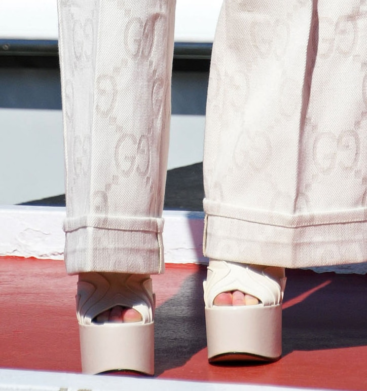 Sadie Sink pairs her Gucci summer jacket and pants with strappy Keyla platform sandals