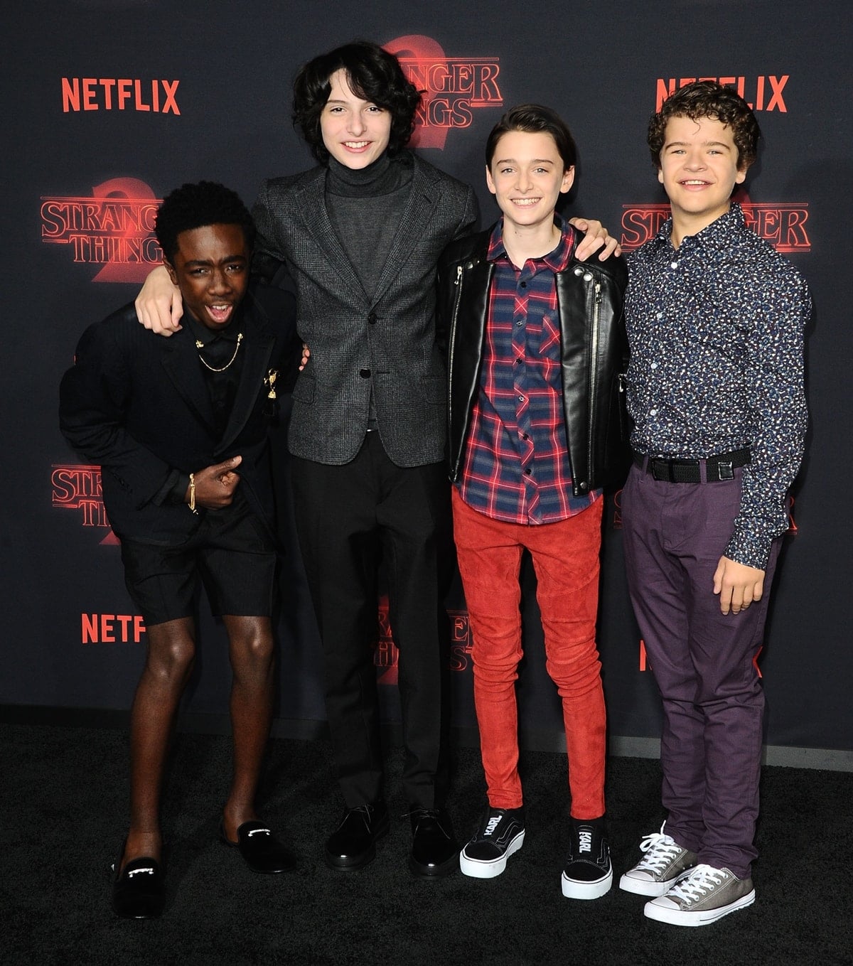 Actors Caleb McLaughlin, Finn Wolfhard, Noah Schnapp, and Gaten Matarazzo arrive at the Premiere Of Netflix's 'Stranger Things' Season 2
