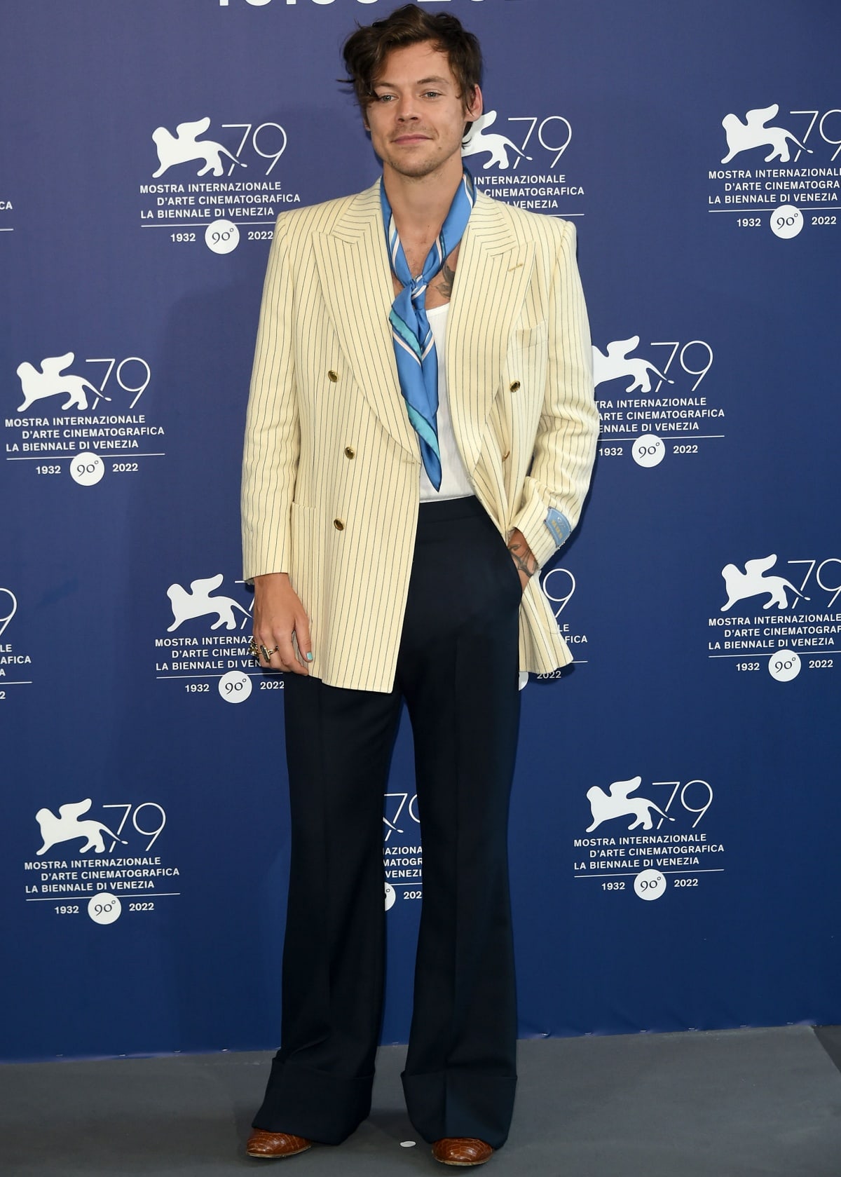 Harry Styles wearing pieces from his Gucci HA HA HA collection at the Don’t Worry Darling photocall