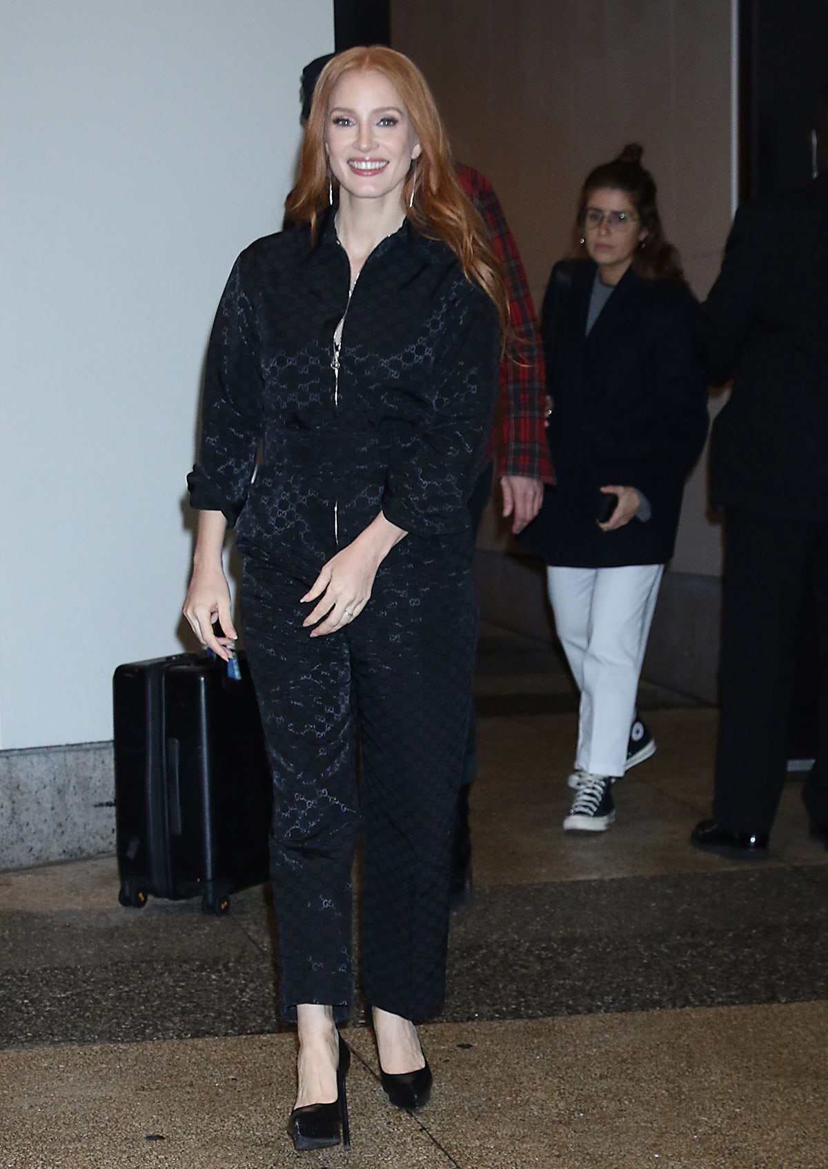 Jessica Chastain steps out at CBS Mornings in a black Gucci jacquard jumpsuit, elevating the sleek look with Gianvito Rossi “Dasha” platform pumps on October 19, 2022