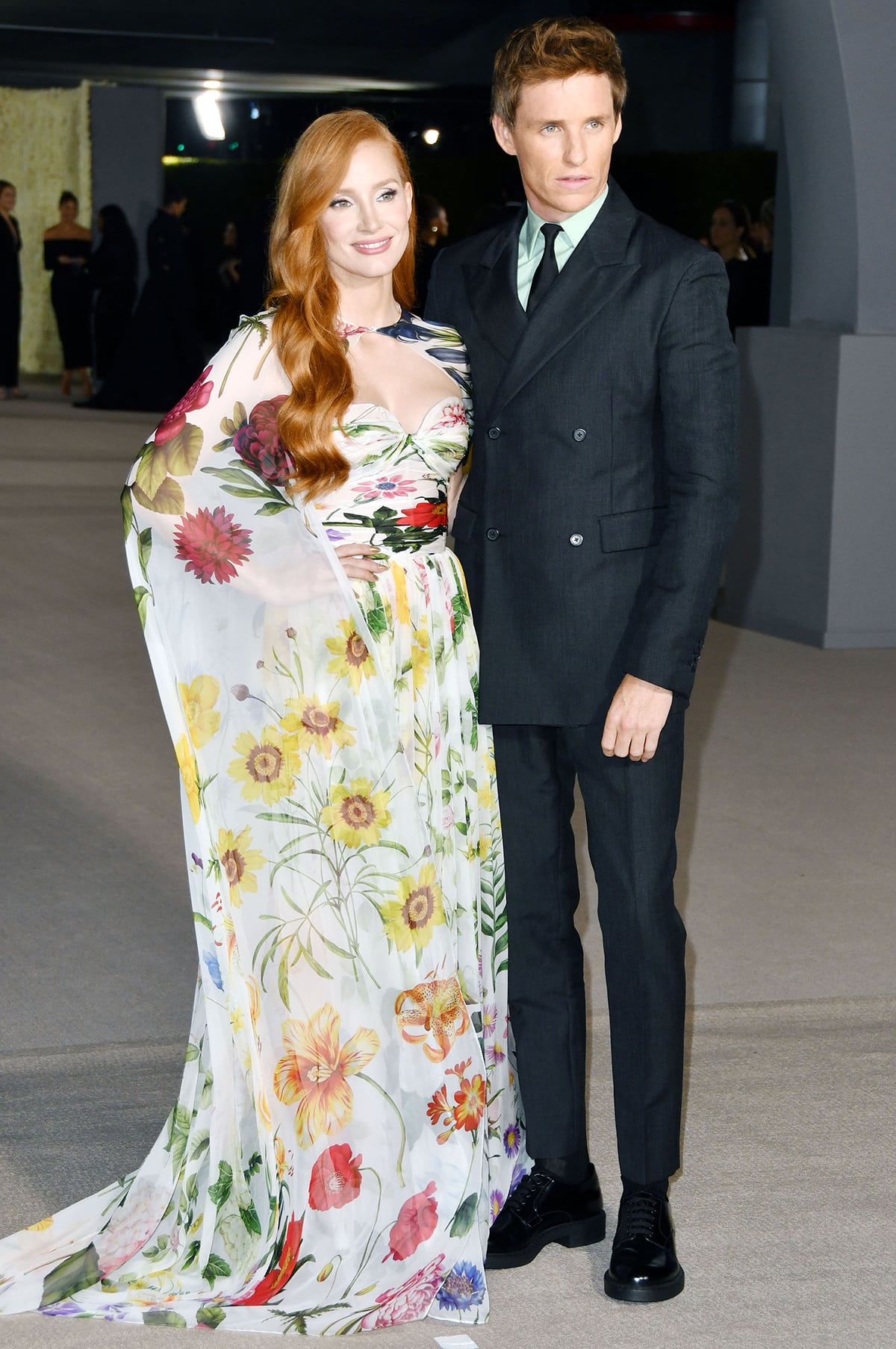 Jessica Chastain and Eddie Redmayne attend the 2nd Annual Academy Museum Gala, with Chastain channeling Old Hollywood glamour in an Oscar de la Renta floral gown paired with gold Casadei platform sandals while Redmayne opts for a sharp Prada double-breasted tuxedo