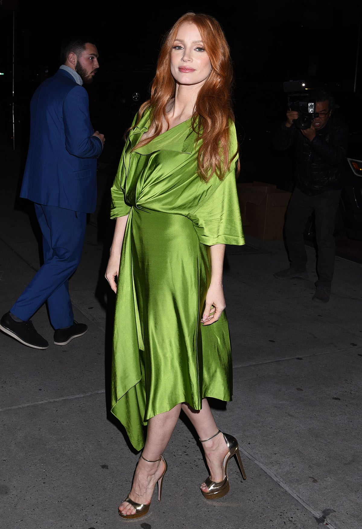 Jessica Chastain shows how to wear a green Victoria Beckham wrap-style dress with metallic platform sandals