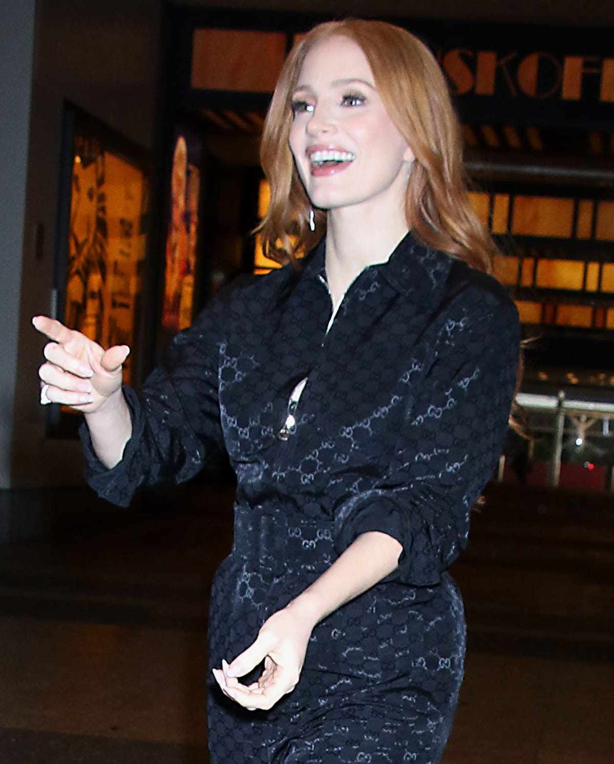 Jessica Chastain wears her long auburn tresses down in waves and highlights her features with soft pink makeup