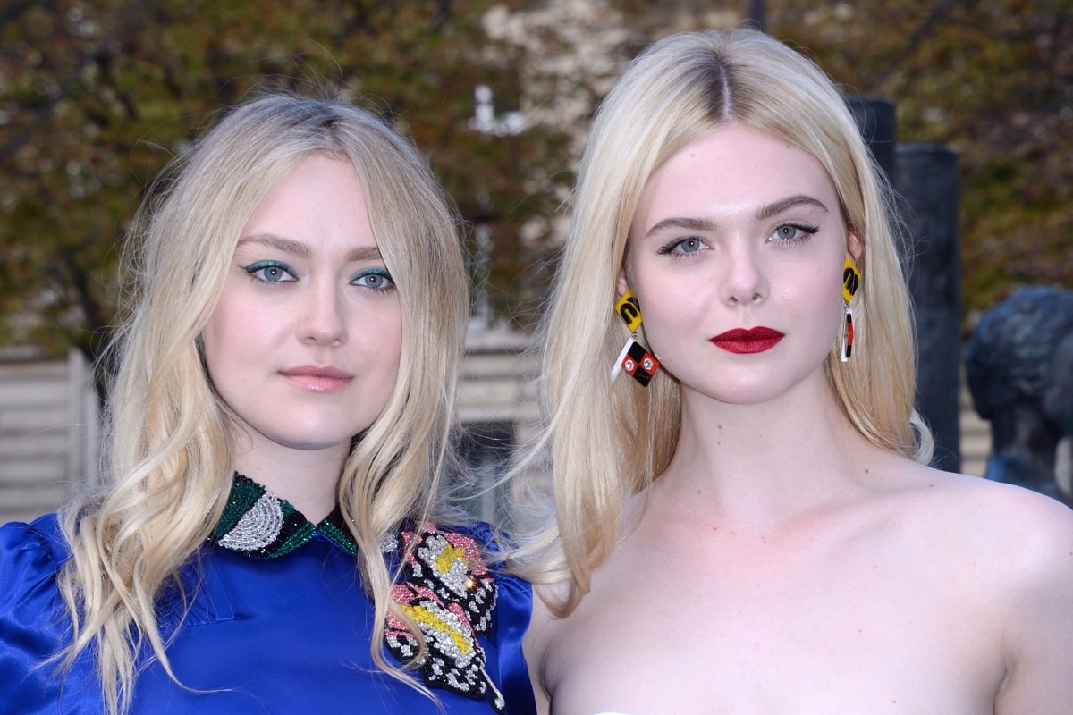 Dakota and Elle Fanning attending the Miu Miu runway presentation during Paris Fashion Week